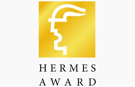 HERMES AWARD 标志，金色图标配黑色文字。