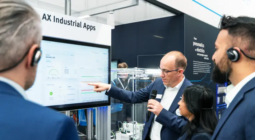 A Festo tour guide explains AX Industrial Apps to Hannover Messe customers.