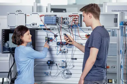 A learner checks sensor data on a smartphone